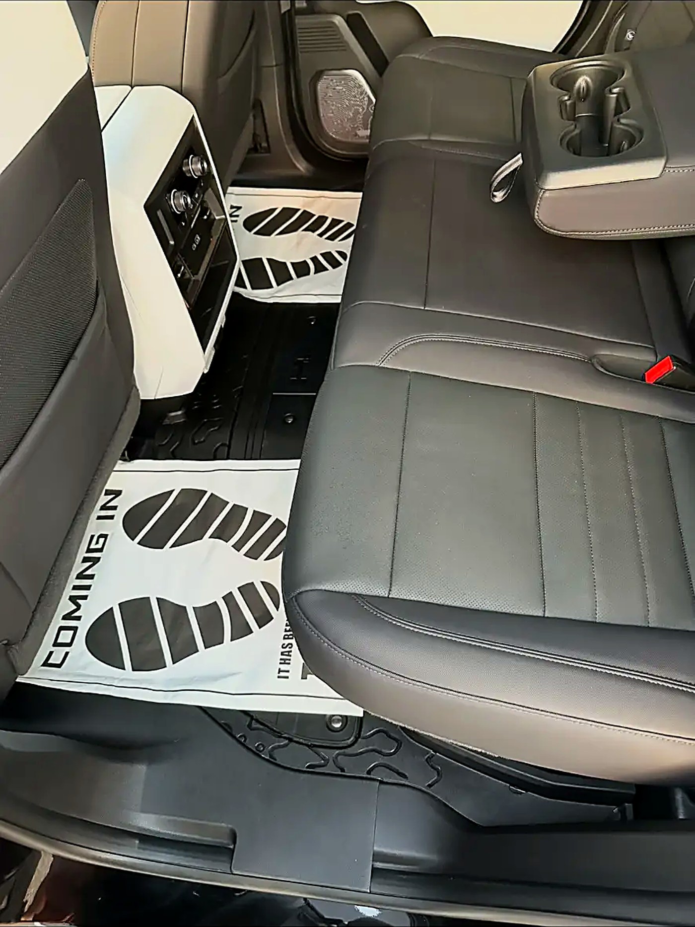 Rear leather bench and floor liners of a truck cleaned and dressed