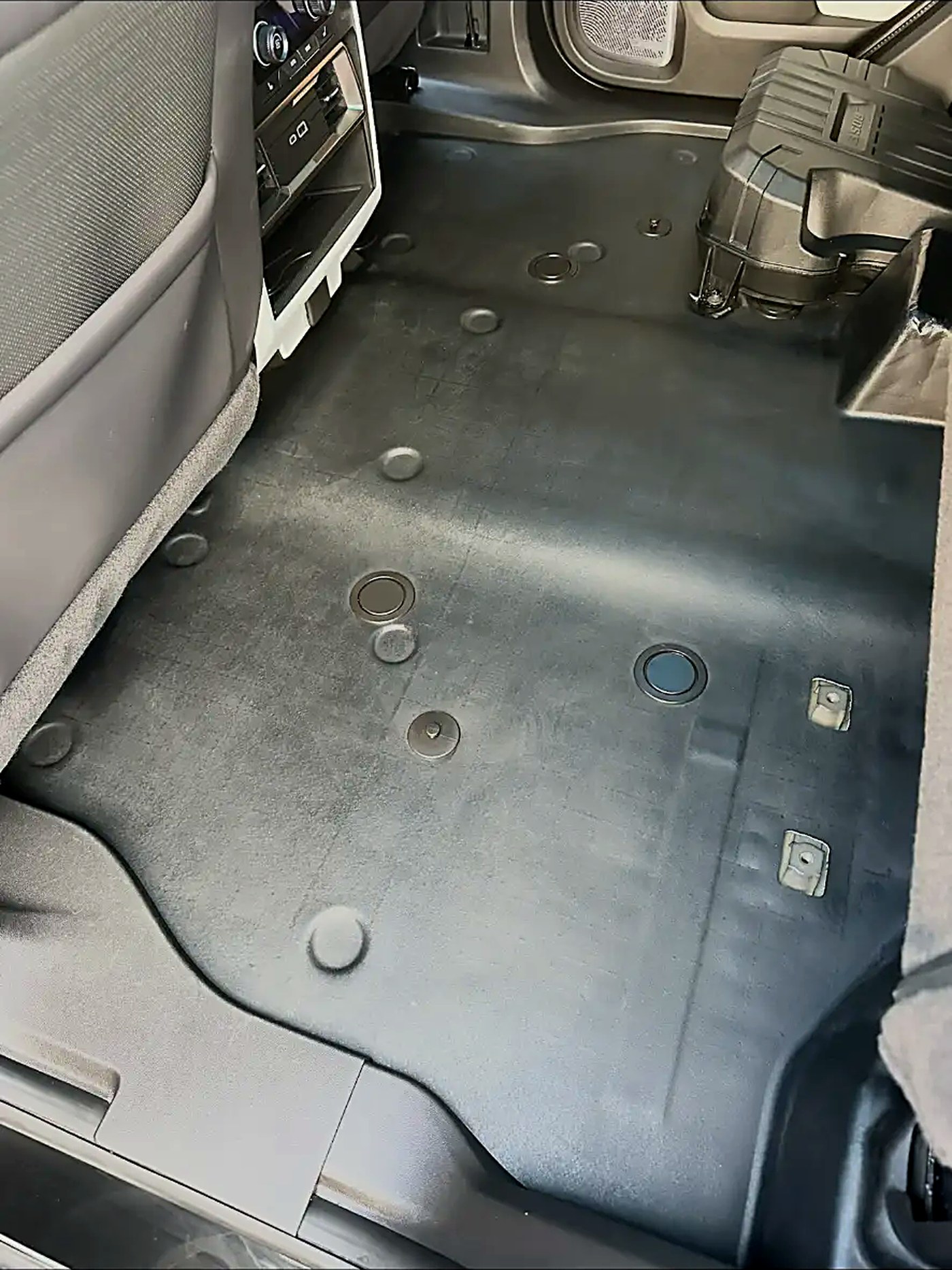 Truck rear floor cleaned down to the bare carpet