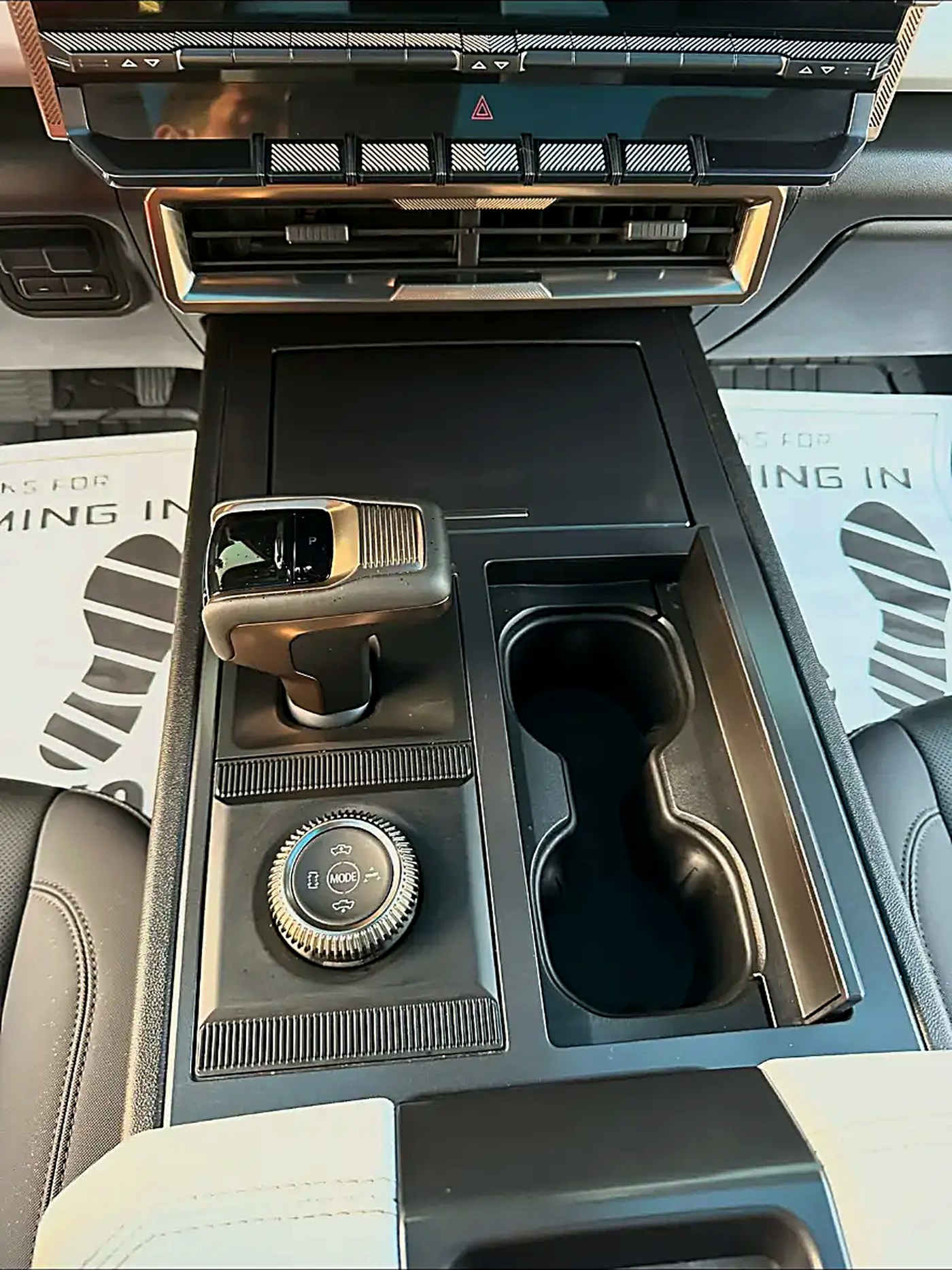 Hummer EV center console and cup holders wiped down after an interior detail