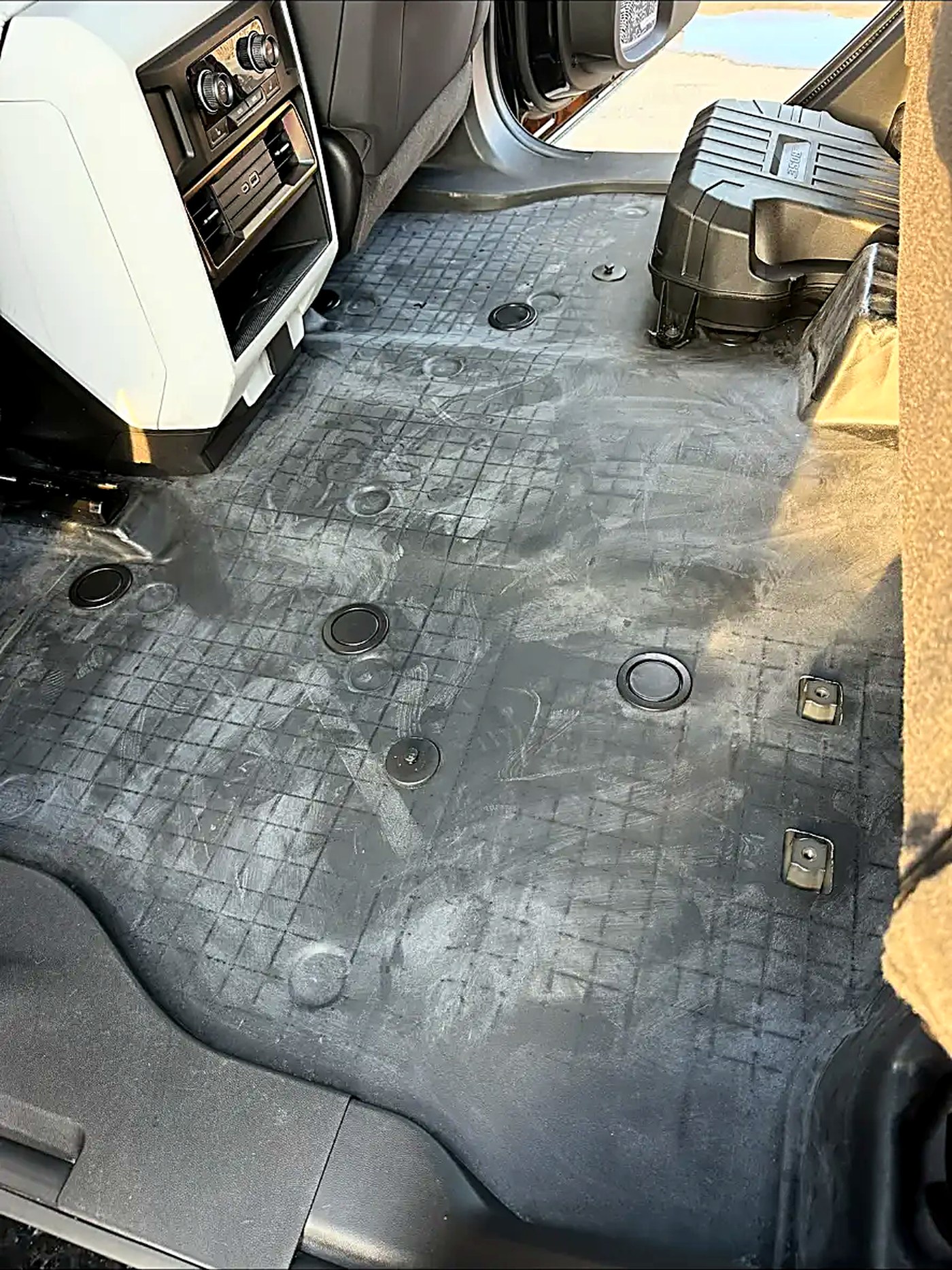 Dusty truck carpet before an extraction and deep interior clean
